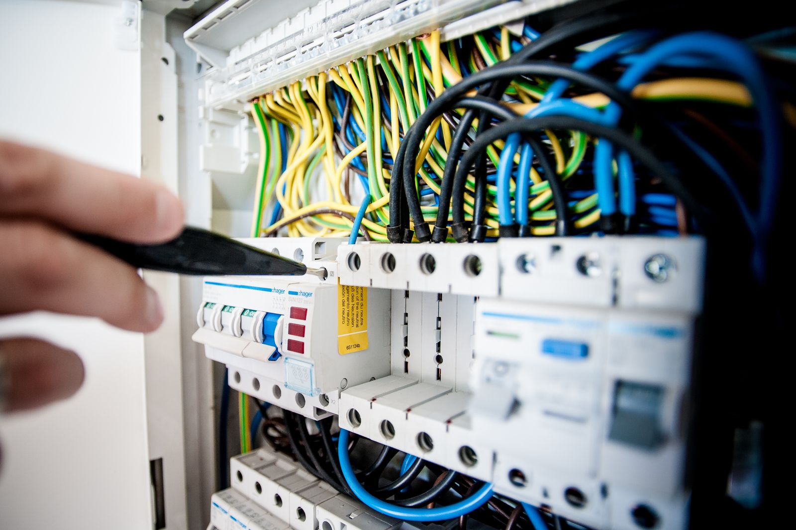 Electrician working on a consumer unit